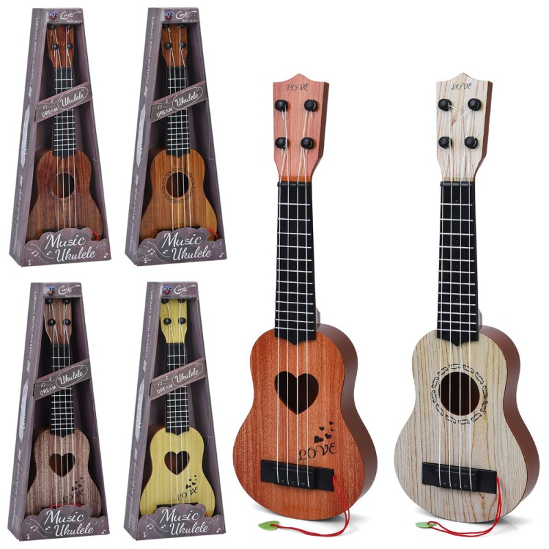 Фотография 1 товарной позиции интернет-магазина детских игрушек www.smarttoys.com.ua Гітара 601A-2-601B-2 42см, 4 струни, медіатор, 2 види по 3 кольори, кор., 16,5-43,5-5,5см